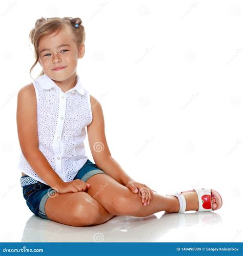 little girl sitting on the floor